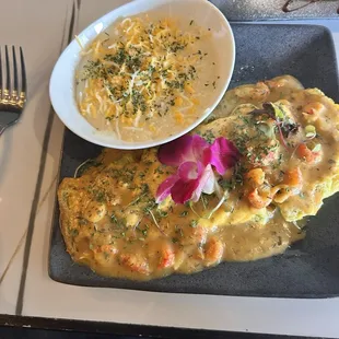 Crawfish omelette and grits
