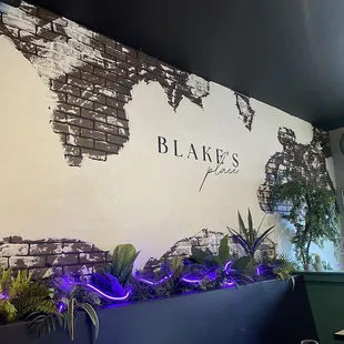 a brick wall and plants