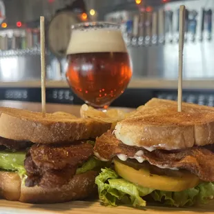 a sandwich and a glass of beer