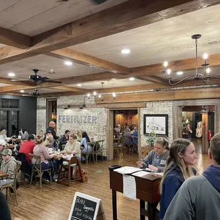 a large group of people sitting at tables