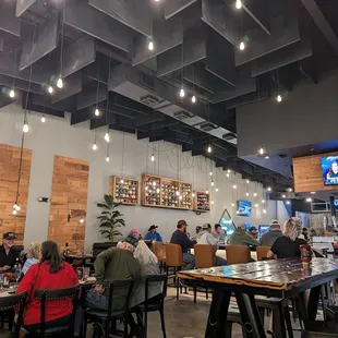 people sitting at tables in a restaurant