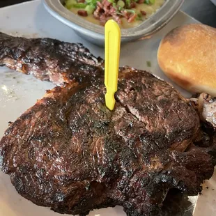 Medium well ribeye w/ loaded mashed potatoes and a roll