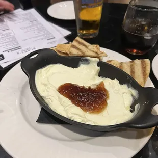 a plate of food and a glass of beer