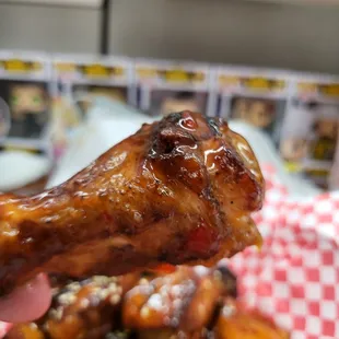 Perfectly cooked wing drenched in sweet chili bbq sauce