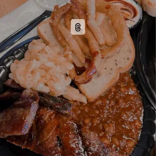 Beef brisket, rib and baked beans with their garlic toast.
