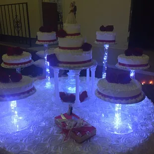 a table with a lighted cake display