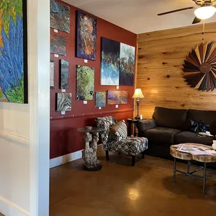 a living room with art on the wall