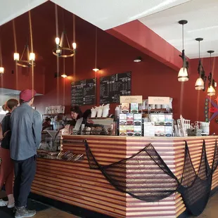 a man and a woman standing at a counter