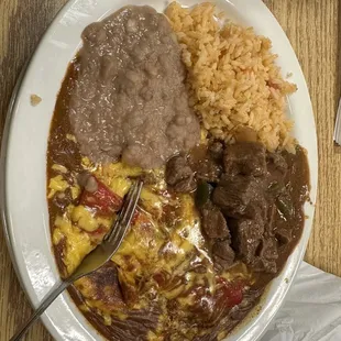 Cheese enchiladas with carne guisada plate