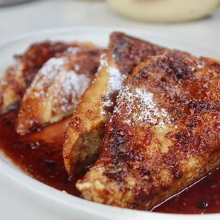 The Ancho Spice French Toast is made with cinnamon sugar brioche, &amp; buttered blackberry syrup.