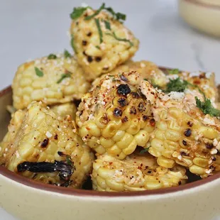 The Grilled Mexican Street corn is made with mayo, cilantro, lime, and cotija cheese. I am a sucker for street corn