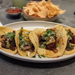 Steak and al pastor tacos; chips and salsa