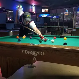 a man playing pool