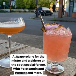 two cocktails on a wooden table