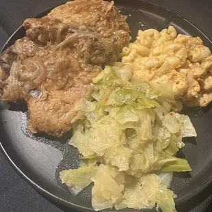 Smothered porch chops, cabbage, and macaroni and cheese