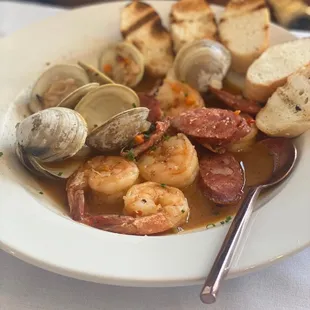 a plate of seafood and bread