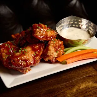 Smoky, tender barbecue chicken wings, glazed with a rich and tangy BBQ sauce.