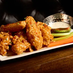 Sweet and savory Orange Soy Flavor  chicken wings, perfectly glazed and irresistible.