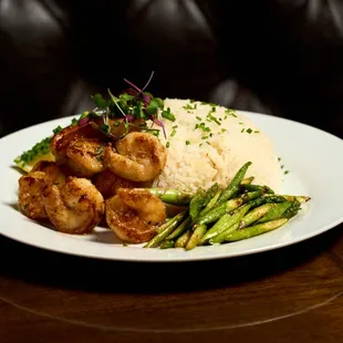 Garlic-butter shrimp scampi served over a bed of fluffy rice, creating a perfect balance of rich flavors and a satisfying bite.