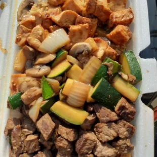 a meal in a styrofoam container