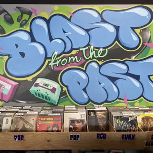 One of our murals, done by a local artist, above our pop, rap, and disco sections!