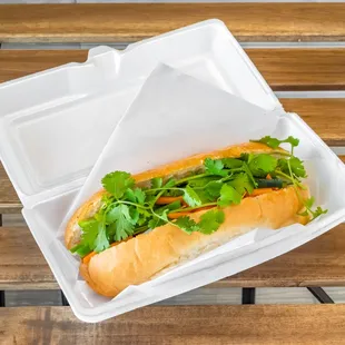 a sandwich in a styrofoam container