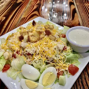 a plate of salad with hard boiled eggs