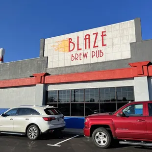 two cars parked in front of the building