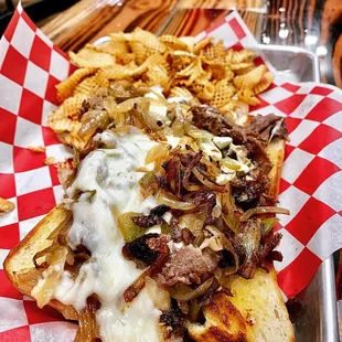 a tray of food with a sandwich and chips
