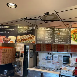 menus on the wall of the restaurant