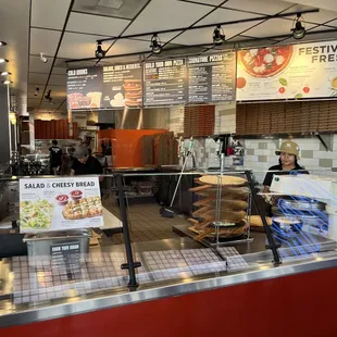 a woman behind the counter