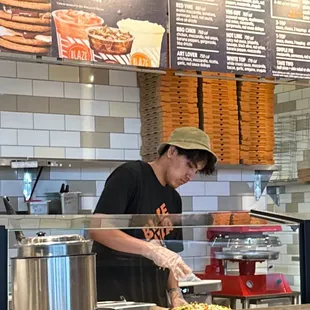 I think company hate is dark and has the logo in front this person Was wearing a fishing hate .