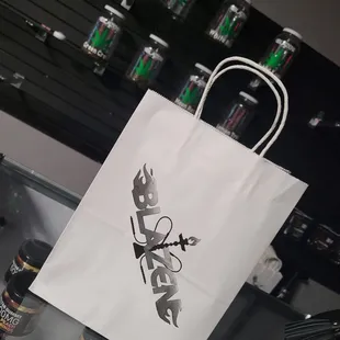 a white paper bag with the word blaze on it