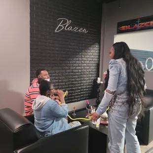 a woman in white jeans and a man in a red striped shirt