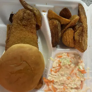 Fried fish with potato wedges and coleslaw. Everything fresh, coleslaw was okay