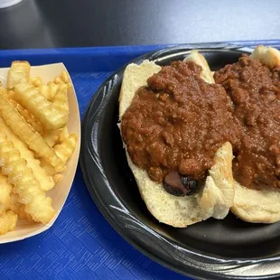 Spicy chili dogs (special - not on the daily menu) and crinkle cut fries.