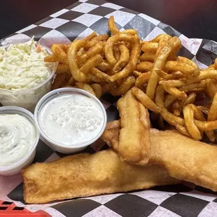 Catfish basket with curley fries, Cole slaw, tartar sauce, and ranch to dip the fries