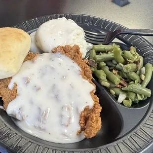 Chicken fried chicken, mashed potatoes and gravy with green beans
