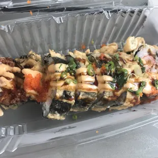 Shrimp dynamite roll... sushi has never tasted this good ! Like it's fried! It's freaking delicious! It's defiantly made with love