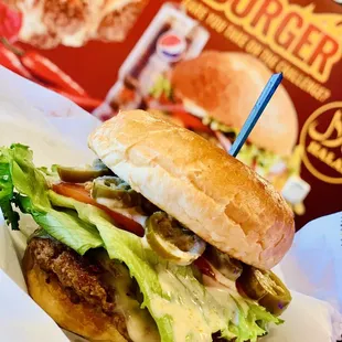 a burger with lettuce and cheese