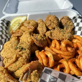 a basket of fried fish and fries