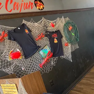 a display of t - shirts hanging on a wall
