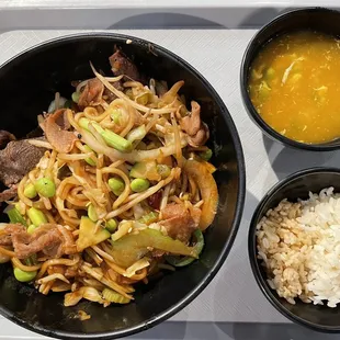 Large bowl with egg drop soup and rice (half brown and half white)