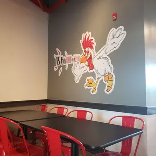 a table and red chairs