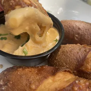 Warm soft pretzel with nacho cheese so good