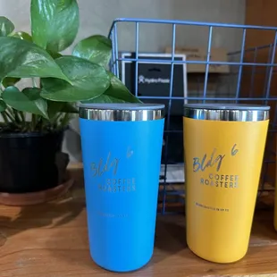 two coffee roasters on a shelf