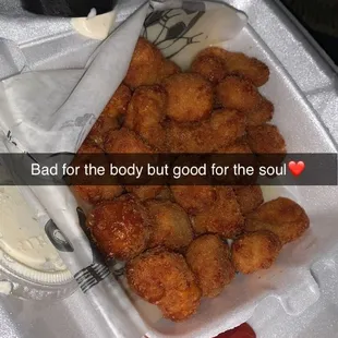 chicken nuggies in a styrofoam container