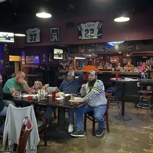 a group of people sitting at a table