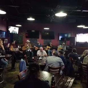 a group of people sitting at tables