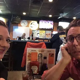 a man and a woman sitting at a table